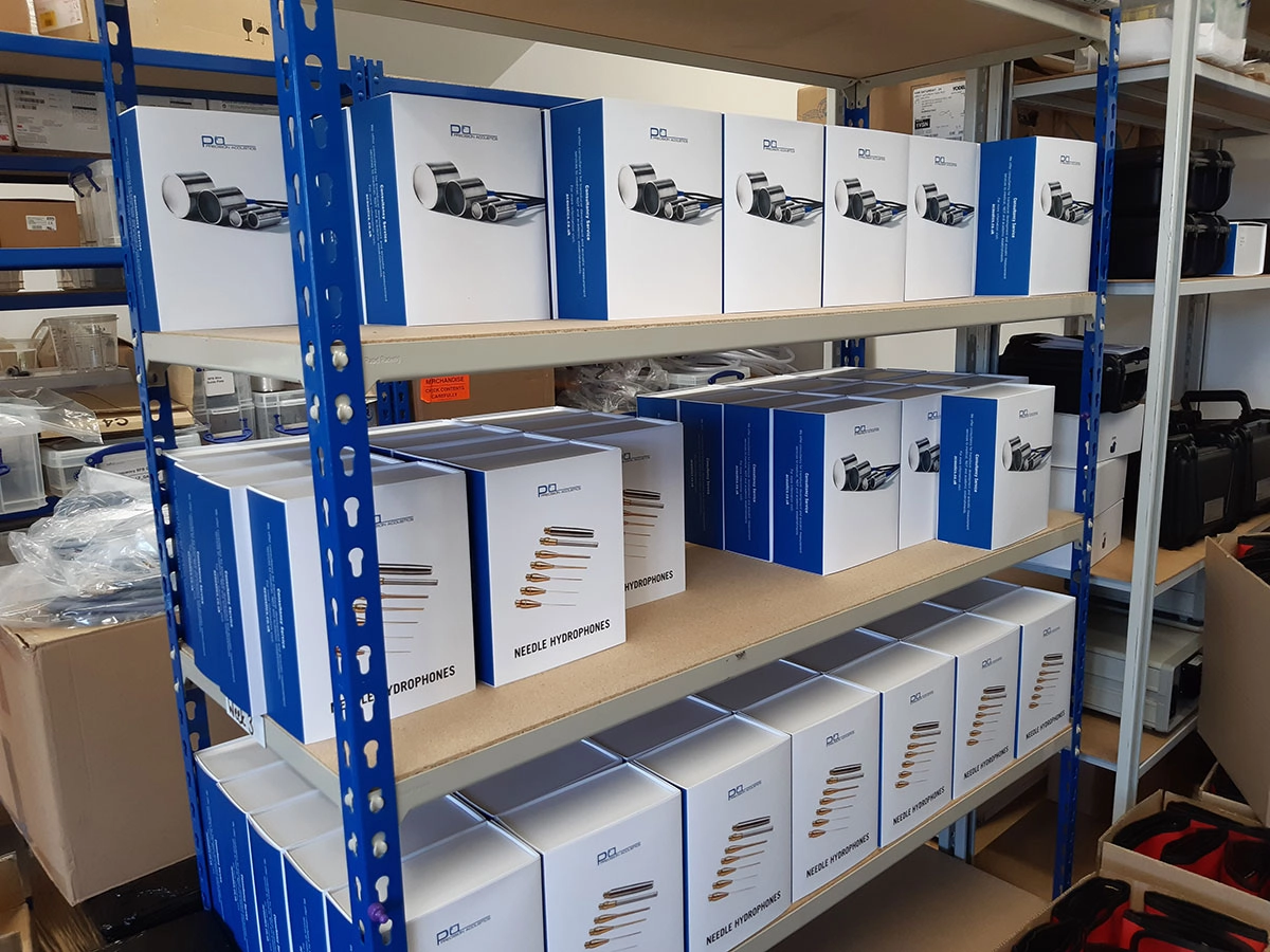 Precision Acoustics new packaging for transducers and hydrophones sat on blue racking