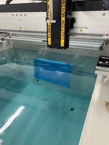 Precision Acoustics anechoic tile submerged in a water tank for testing
